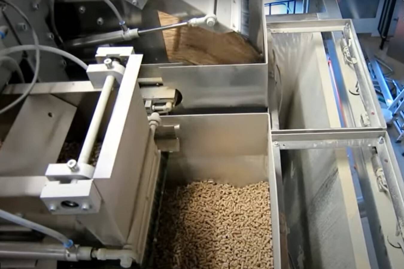 Still of video of wood pellets packing line